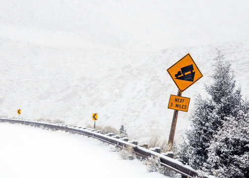 down-hill attention sign for truckers in mountain