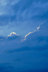Beautiful blue sky with the edge of the cloud illuminated by the sun.