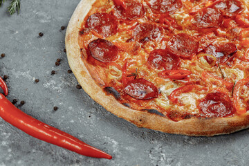 Thinly sliced pepperoni is a popular pizza topping in American-style pizzerias