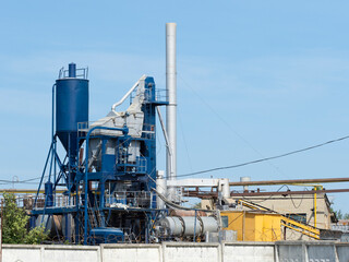 Fototapeta na wymiar Horizontal photo of a blue industrial building on a factory. Concrete factory