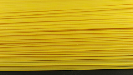 Yellow long spaghetti on white background