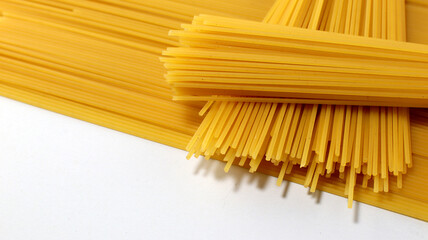 Yellow long spaghetti on white background