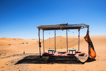 leisure place in the middle of the desert. Sahara landscape, merzouga morocco. Vacation scene. ...