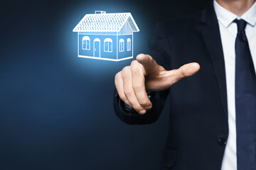 Fototapeta na wymiar Real estate agent touching house illustration on virtual screen against dark background, closeup