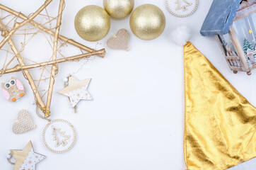 Gold and wooden Decoration objects on a white Background with space for text.