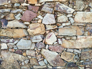 Old stone wall background texture. Horizontal.