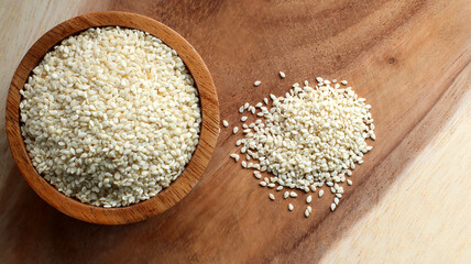 White sesame seeds in a wooden bowl