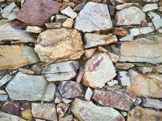 Old stone wall background texture close up