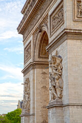 Fototapeta na wymiar Detail of sculptures and inscriptions of the Arc de Triomphe (Triumphal Arch) of Paris at Champs Elysees