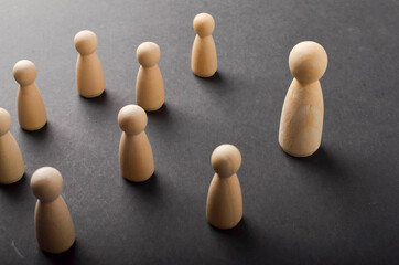 Business & HR global wood puzzle concept for leadership and team with peg doll. Selective focus.