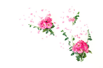 Floral composition of pink roses flowers with leaves on white background. Flat lay
