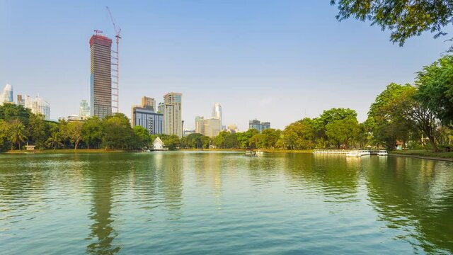 Footage 4k Timelapse of city view from Lumpini park in Bangkok, Public park where is settle at the center of Bangkok on a rented boat activity.