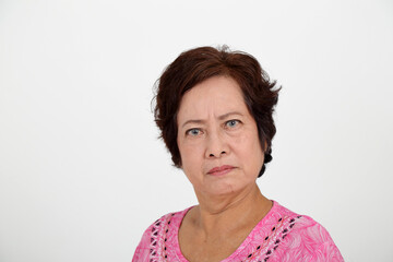 Elderly asian Chinese female on white background look at camera angry serious