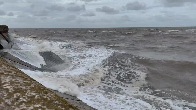 Large Waves Crashing Into Sea Wall