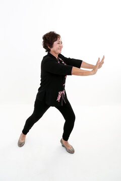 Elderly Asian Chinese Female Wearing Black Tang Samfu On White Background Exercise Tai Chi