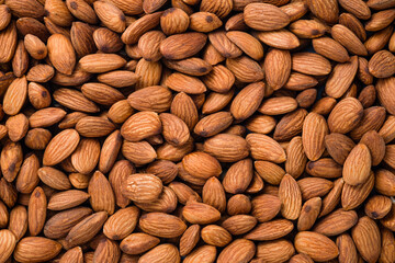 Top view of fresh raw peeled almonds nut for background.