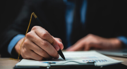 Hand signature sign approved business contract for certify and permit on the paper document