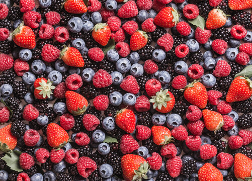 Fresh mix of berries fruits background.