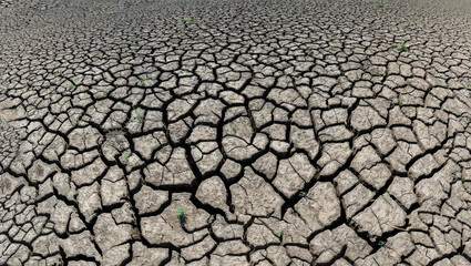 Part of a huge area of dried land suffering from drought in cracks.