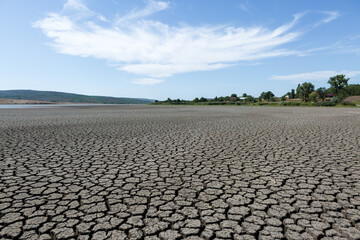 Part of a huge area of dried land suffering from drought in cracks.
