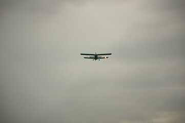 An-2 plane flies through the sky