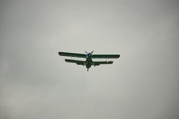 An-2 plane flies through the sky