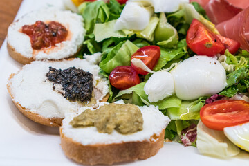 Ricotta Bruschetta with Italian salad and mozzarella cheese