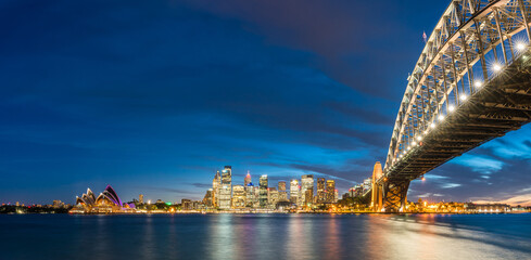 Colorful Sydney downtown skyline with harbor bridge at night in Sydney, New South Wales, Australia