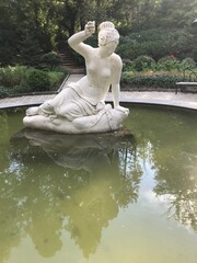 statue of a woman in a park