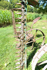 antique hay mower from the side