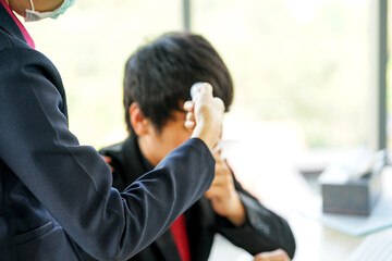business woman worked in the office wearing surgical face mask to prevent from virus pandemic with her colleague employee