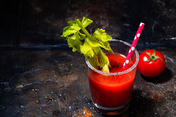 alcoholic cocktail bloody mary on dark background, top view