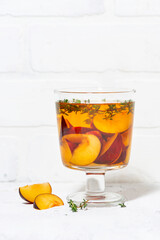 flavored black tea with plum and thyme, vertical