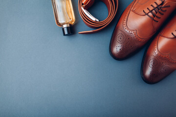 Oxford male brogues shoes with accessories. Men's fashion. Classical brown leather footwear with...