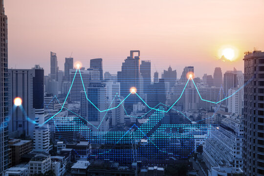 Market behavior graph hologram, sunset panoramic city view of Bangkok, popular location to achieve financial degree in Asia. The concept of financial data analysis. Double exposure.