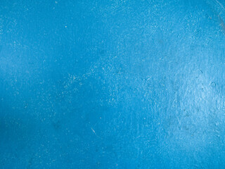 Closeup on matt painted blue surface texture