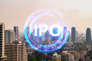 IPO icon hologram over panorama city view of Bangkok, the hub of initial public offering in Asia....