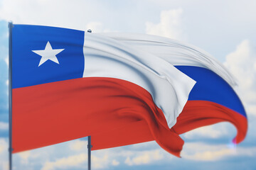 Waving Russian flag and flag of Chile. Closeup view, 3D illustration.