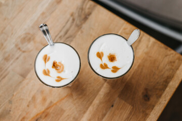 Coffee with hearts on a wooden table