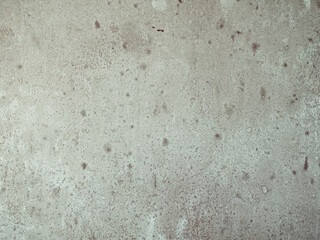 Closeup on old grey spotted concrete wall 
