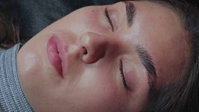 Girl after lash and eyebrow lamination procedure close-up
