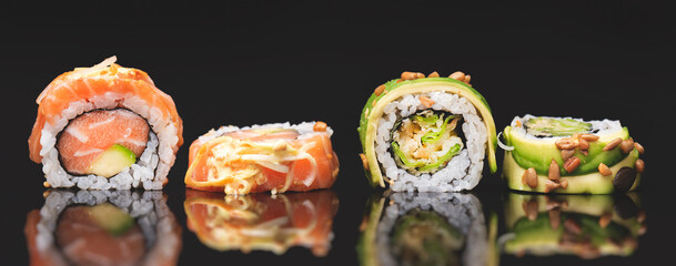 Sushi roll set on black glass background © Proxima Studio