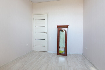 The interior of an empty room prepared for moving to another apartment