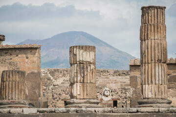 The Temple of Jupiter, Capitolium, or Temple of the Capitoline Triad, was a temple in the forum of Roman Pompeii with volcano Mount Vesuvius © Simone