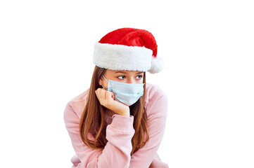 Bored sad teenager girl in red Santa Claus Christmas hat and medical mask looking away isolated on white background. Protection against viruses, infection prevention. Christmas time