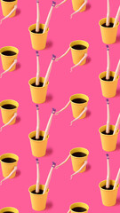 Coffee cups with female doll hands, legs and head on pink background. Minimal coffee lovers concept. Flat lay.