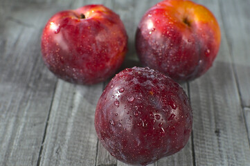Fresh red plums, summer fruit.