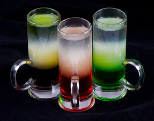 alcoholic cocktail shot in a glass on a black background