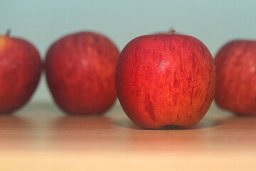 red apples on a wooden table