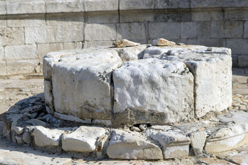 Old cut stones stacked in a circle